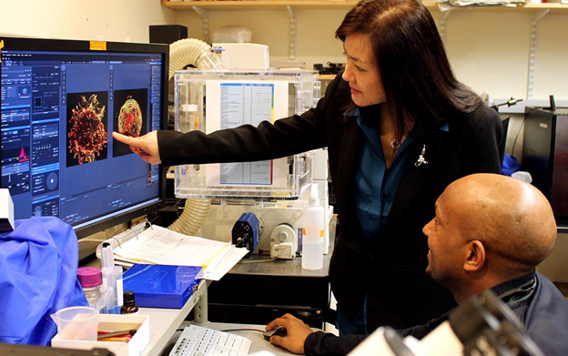 Dr Tsai, an Asian woman with straight black hair, and postdoctoral fellow Dr Meharena, a black man.