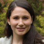 hadshot of a white woman with long dark brown hair outside