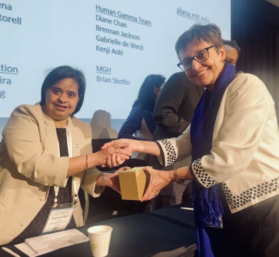 Panelist Jaspreet Kaur Sekhon shakes hands with the host, Professor Rhonda Faragher at the World Down Syndrome Congress.